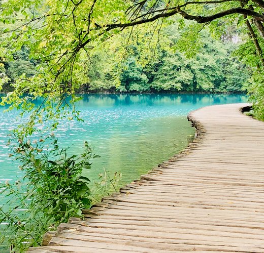 Boardwalk over turqouise waters in Plitvice National Park, Croatia